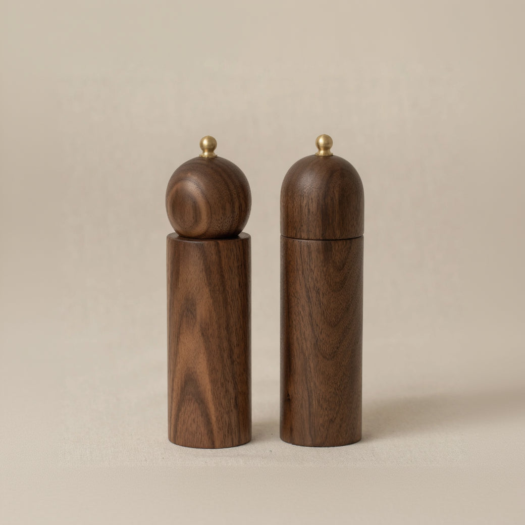 Wooden salt and pepper shakers on walnut
