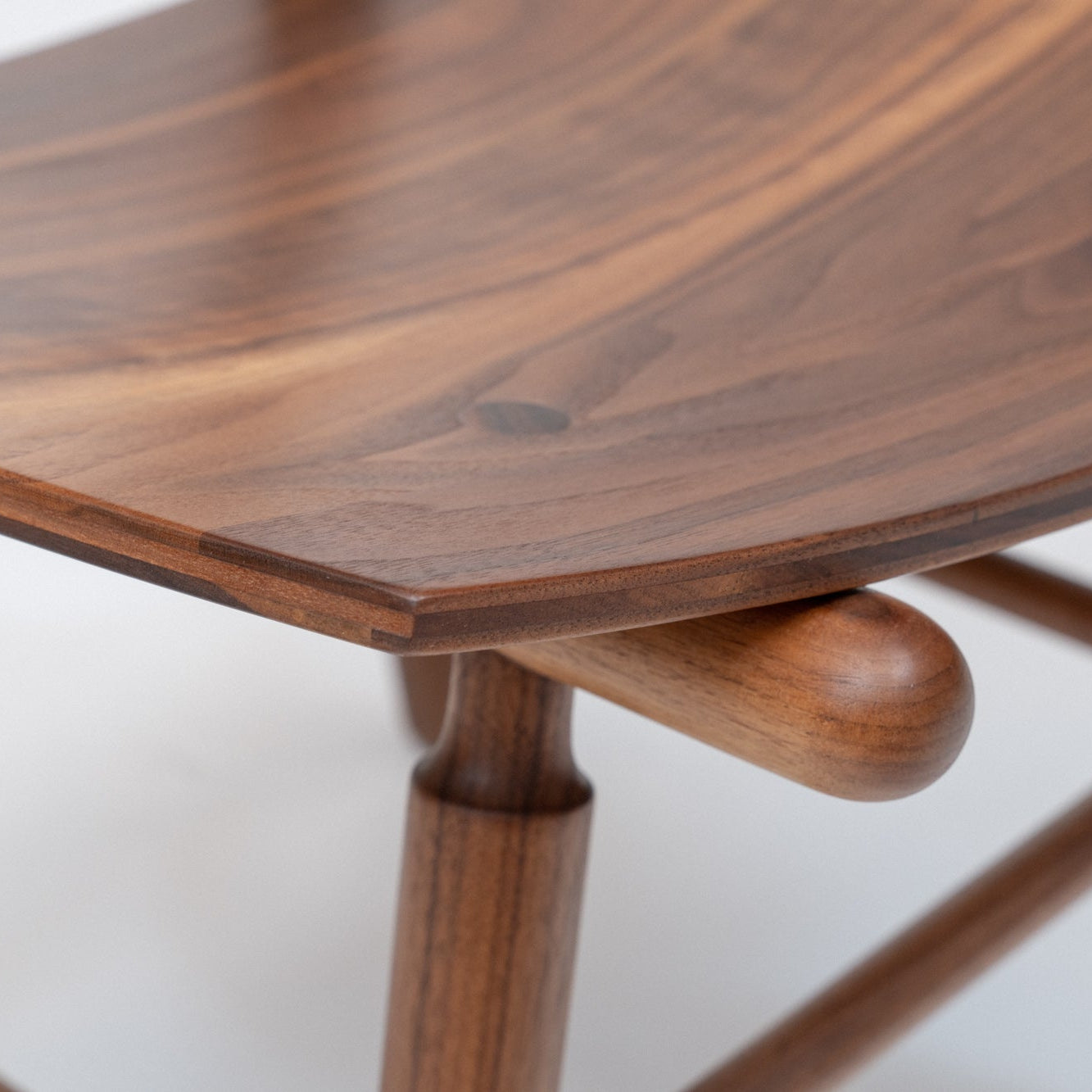 Close-up of a wooden chair with a white background