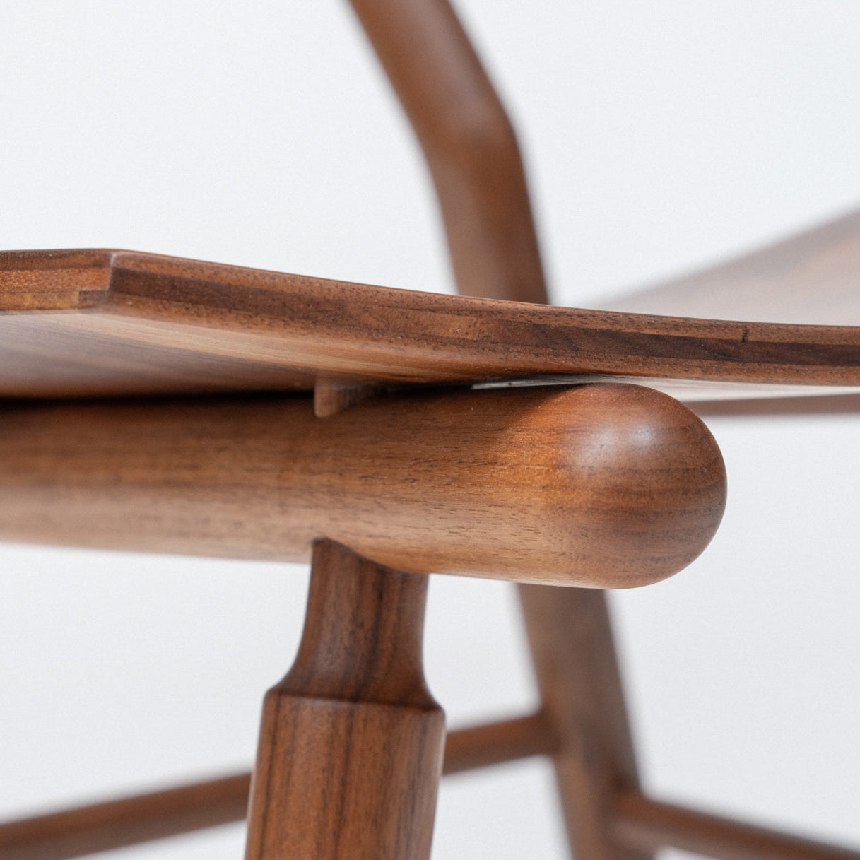 Close-up of a wooden chair with a white background